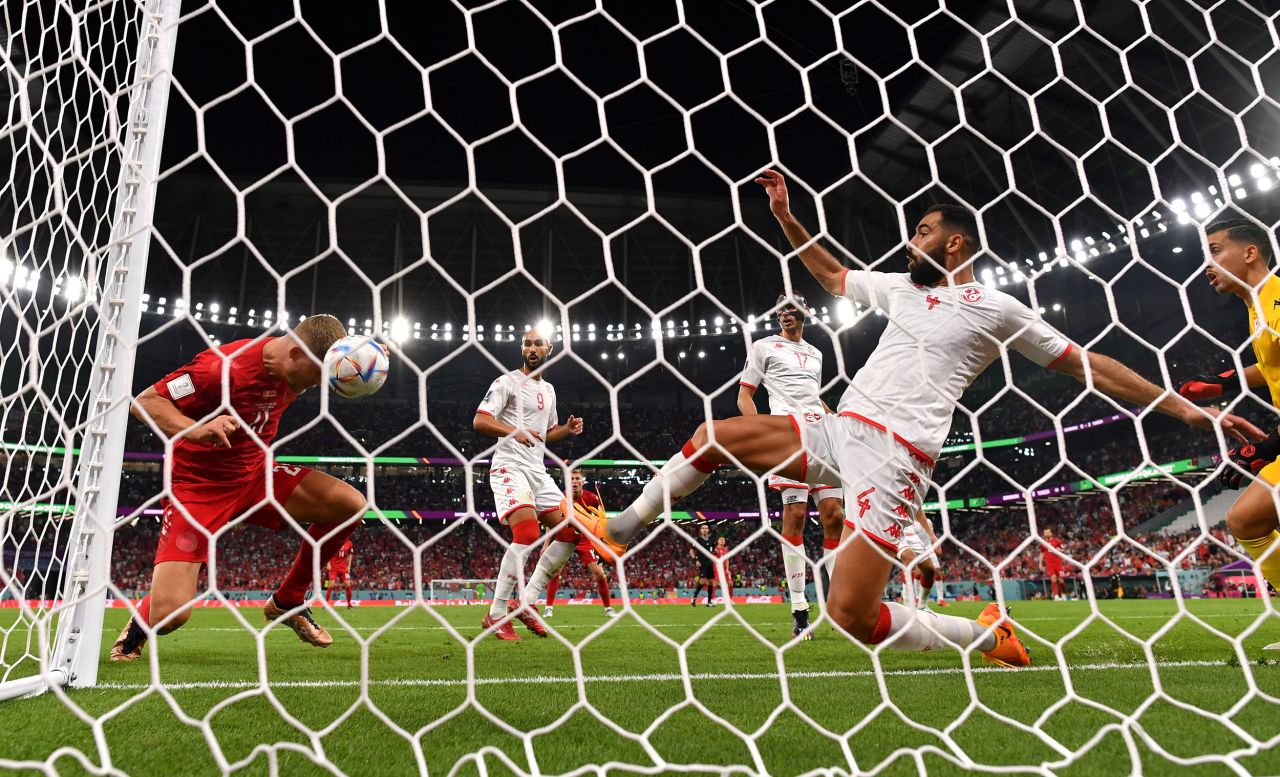 Tunisia's Yassine Meriah stretches to defend a header from Denmark's Andreas Cornelius during their 0-0 draw on Tuesday.