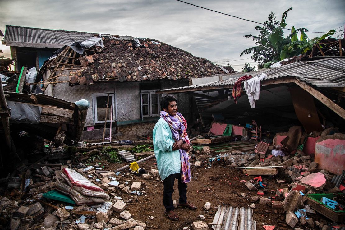 A villager looks at damaged houses in Cianjur on November 22, 2022.