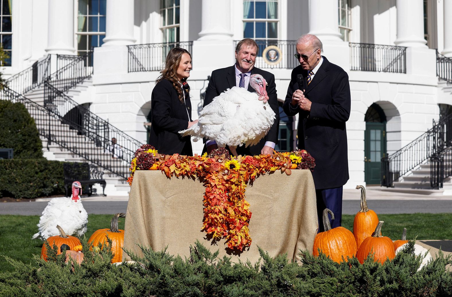 Biden attends the traditional White House ceremony to "pardon" a couple of turkeys on Monday. This year's turkeys were named Chocolate and Chip.