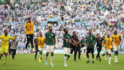 The Saudi players celebrate their shock victory. 