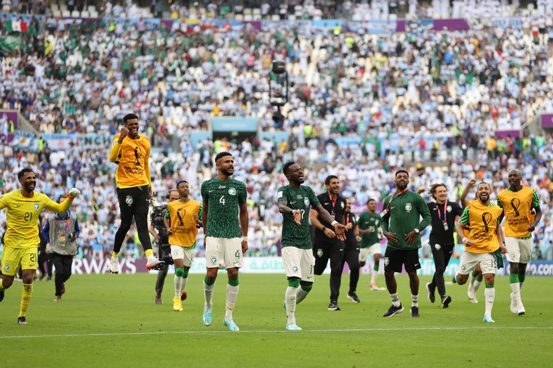 Saudi Arabia players celebrate their shock win. 