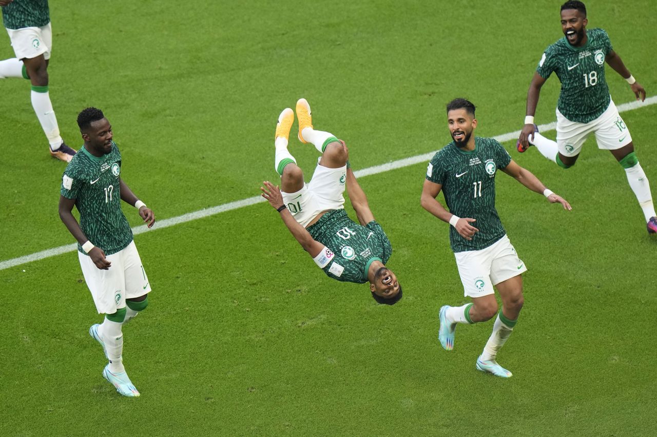 Saudi Arabia's Salem Al-Dawsari does a flip after scoring his team's second goal against Argentina.