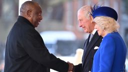 South Africa's President Cyril Ramaphosa (L) is greeted by Britain's King Charles III and Britain's Camilla, Queen Consort during a Ceremonial Welcome on Horse Guards Parade in London on November 22, 2022, at the start of the President's two-day state visit.