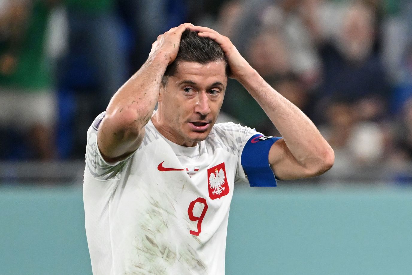 Poland striker Robert Lewandowski reacts after he missed a second-half penalty in his team's 0-0 draw against Mexico on Tuesday.