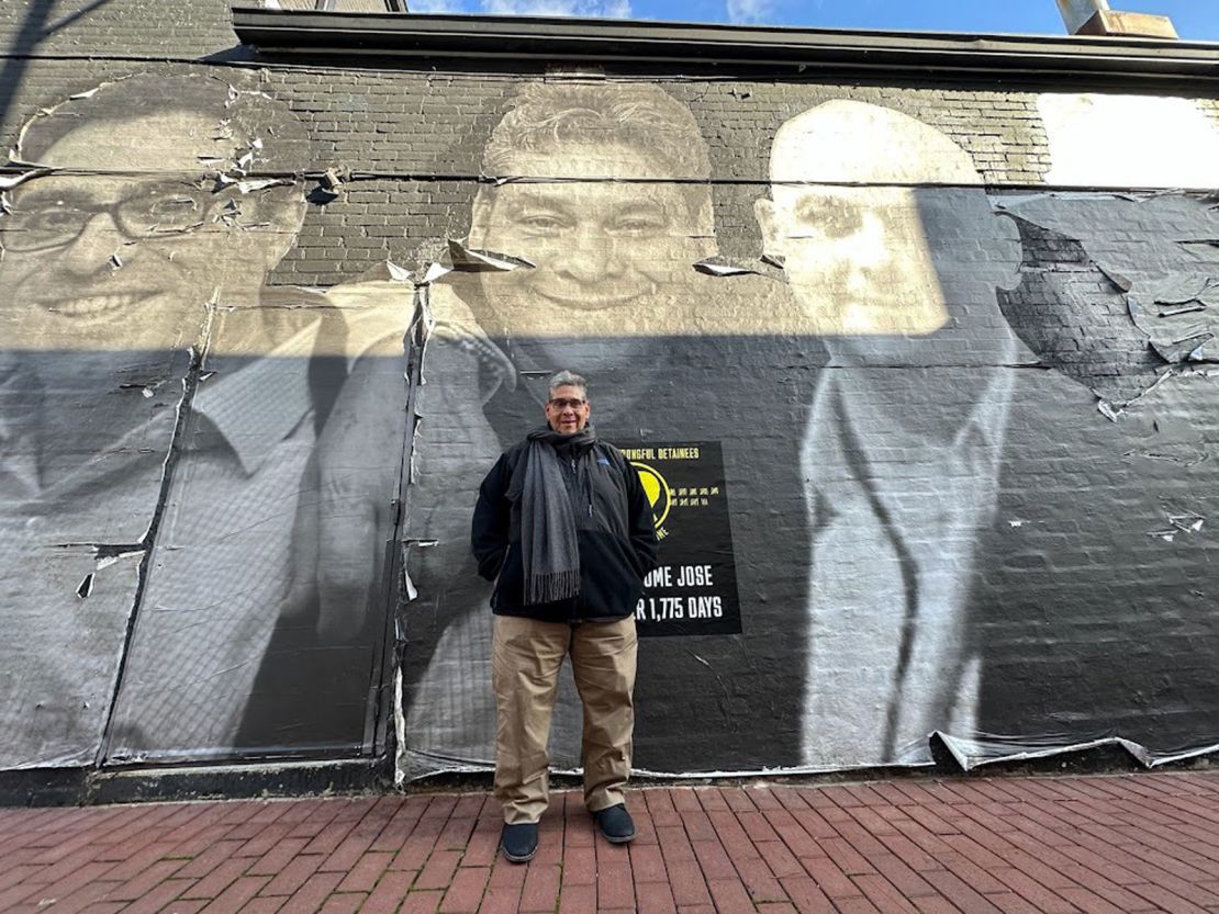 Jose Pereira stands in front of his likeness on a mural in Washington, DC, on November 17, 2022.