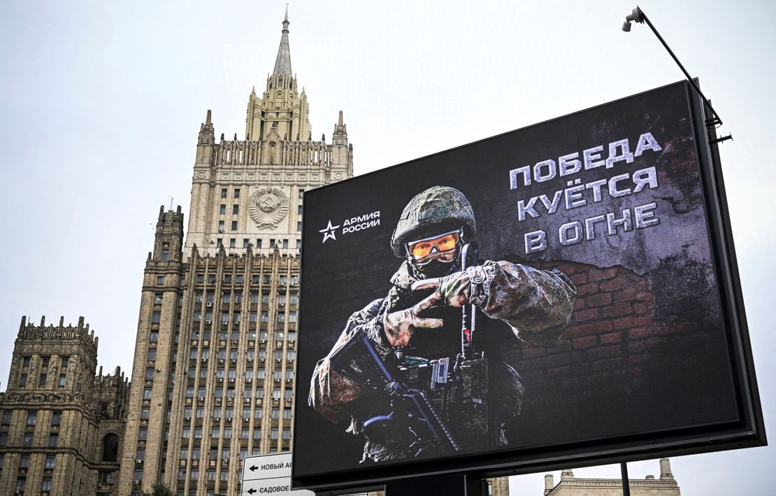 The Russian Foreign Ministry building is seen behind an advertising billboard showing the letter "Z" -- a tactical insignia of Russian troops in Ukraine -- and reading "Victory is being Forged in Fire" in central Moscow on October 13, 2022.