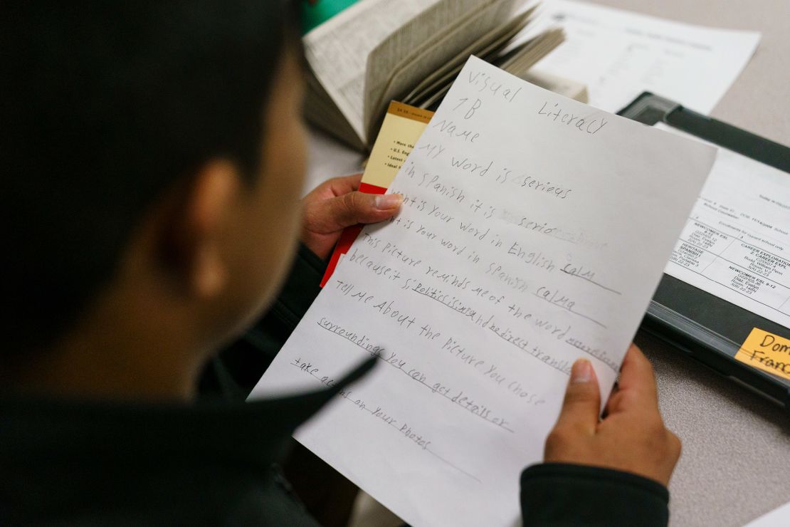 A student looks at schoolwork during an English as a New Language class at The Howard High School.