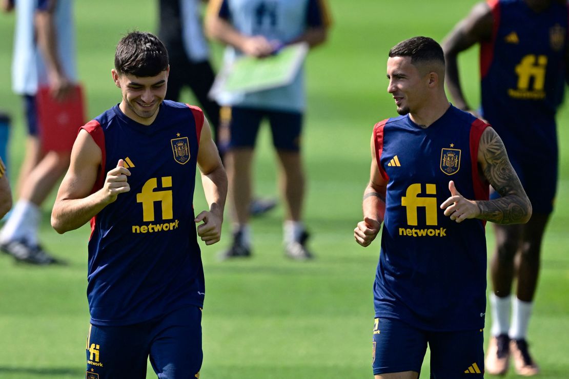 Pedri (left) and Yeremy Pino (right) take part in a training session at Qatar Universty in Doha on November 21, 2022.