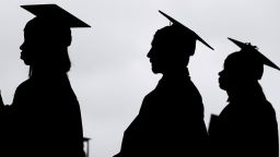 FILE - New graduates line up before the start of a community college commencement in East Rutherford, N.J., May 17, 2018. A federal judge in St. Louis on Thursday, Oct. 20, 2022, dismissed an effort by six Republican-led states to block the Biden administration's plan to forgive student loan debt for tens of millions of Americans.