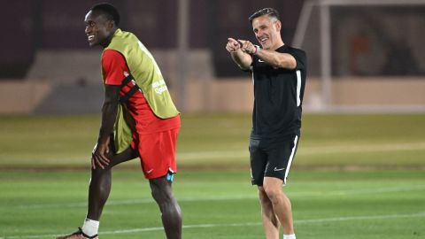 Canada's head coach John Herdman gestures while being flanked by defender Richie Laryea during a training session at the Umm Salal SC training site in Doha on November 22, 2022.