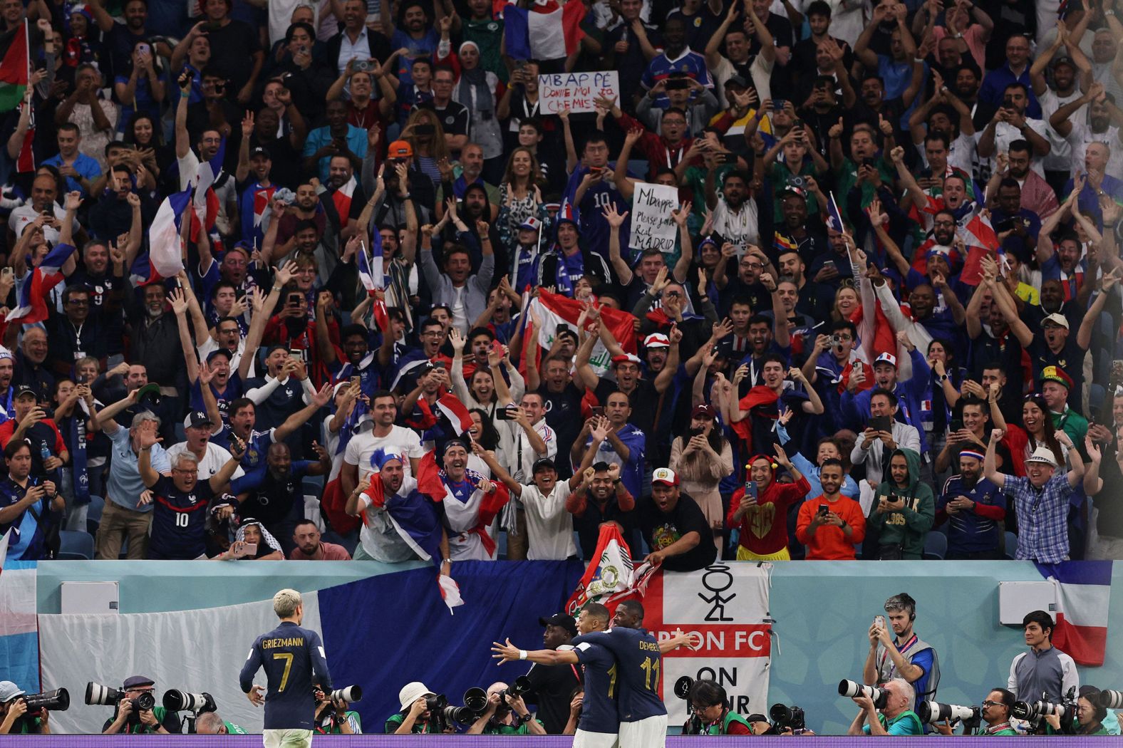 French players swarm Kylian Mbappé after he scored the team's third goal on November 22. Mbappé was one of the leading stars of the team's World Cup triumph four years ago.