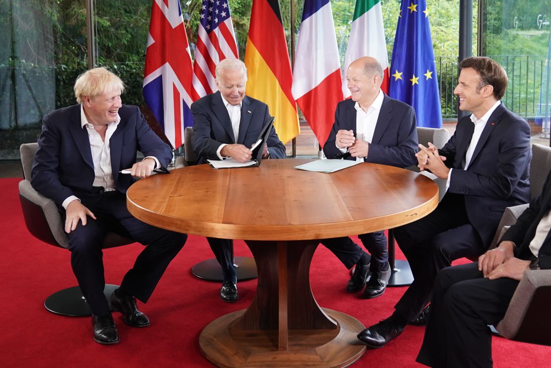 Johnson speaking with US President Joe Biden, German Chancellor Olaf Scholz and French President Emmanuel Macron during a June G7 summit in Germany.