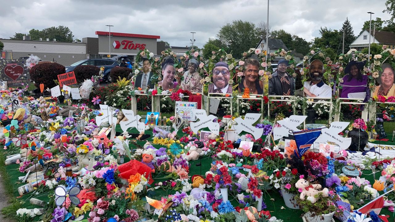 A memorial outside the Tops supermarket in Buffalo, New York, on August 22, 2022, displays the names and photos of the victims of the May 14 shooting.