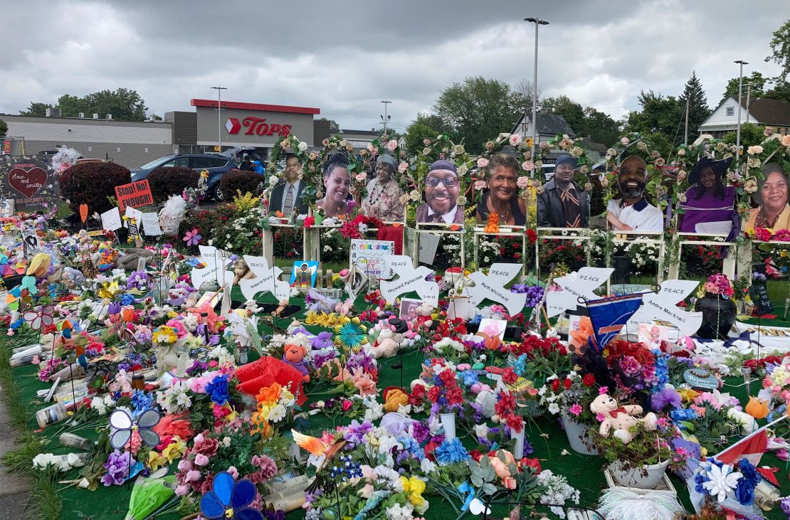 A memorial outside the Tops supermarket in Buffalo, New York, on August 22, 2022, displays the names and photos of the victims of the May 14 shooting.