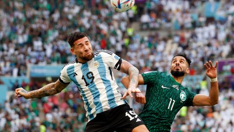 Argentina defender Nicolas Otamendi (19) and Saudi Arabia forward Saleh Al-Shehri (11) battle for the ball during a group stage match during the 2022 World Cup at Lusail Stadium. 