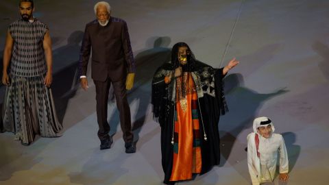 US actor Morgan Freeman (2nd L), Qatari singer Dana al-Fardan (2nd R), and Qatari YouTuber Ghanim al Muftah (R) perform during the Qatar 2022 World Cup opening ceremony on Sunday.