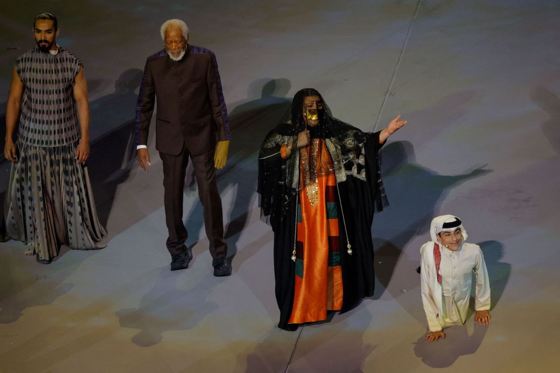US actor Morgan Freeman (2nd L), Qatari singer Dana al-Fardan (2nd R), and Qatari YouTuber Ghanim al Muftah (R) perform during the Qatar 2022 World Cup opening ceremony on Sunday.