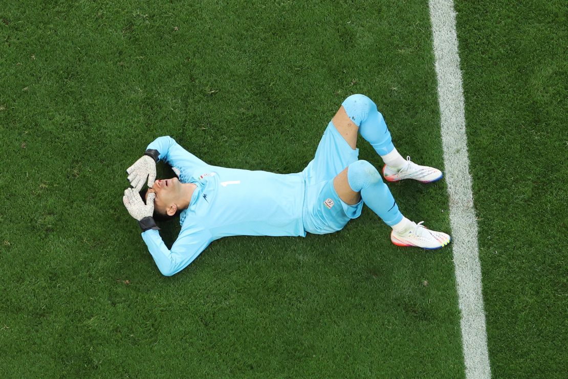 Beiranvand lies injured during Iran's game against England. 