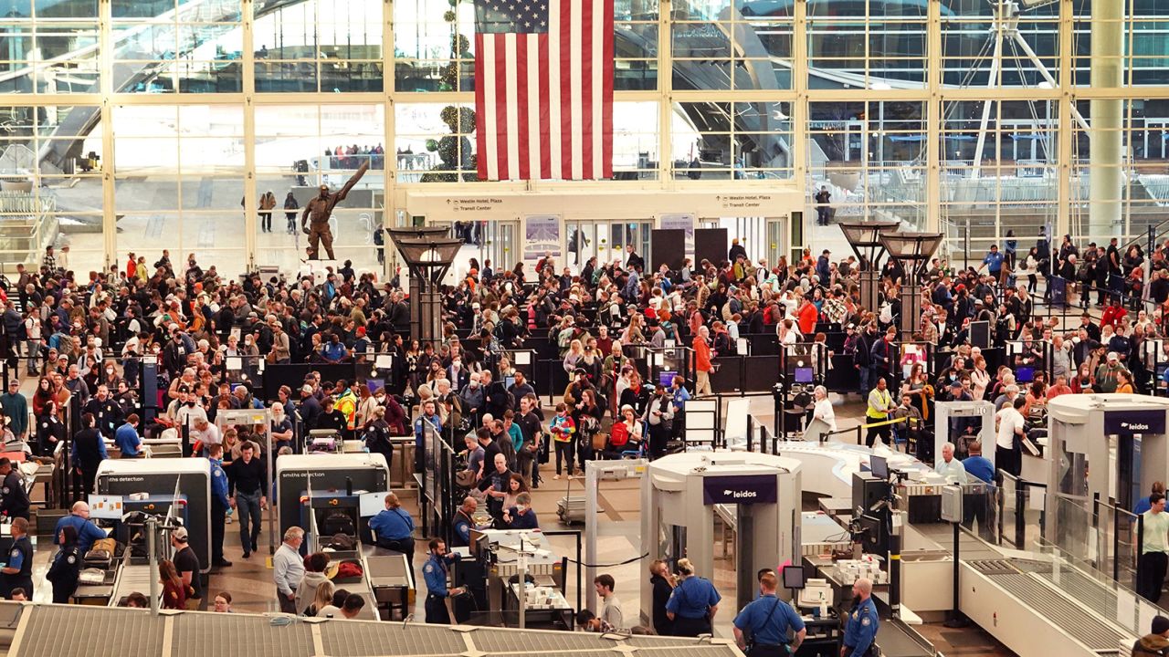 Travelers at Denver International Airport on November 22, 2022. 4.5 million Americans are set to travel by air over the Thanksgiving holiday.