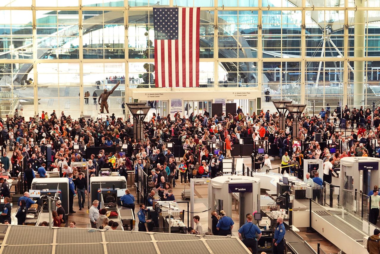 Travelers at Denver International Airport on November 22, 2022. 4.5 million Americans are set to travel by air over the Thanksgiving holiday.