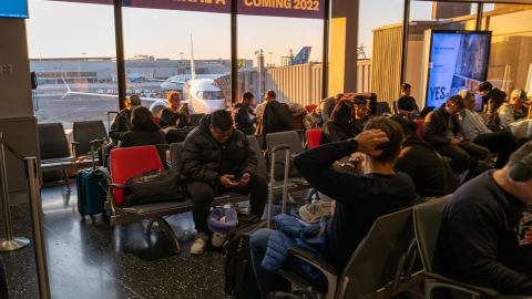 Flying can be nerve-wracking, especially on busy flights. Pictured here: travelers waiting at Newark Liberty International Airport on November 22, 2022.