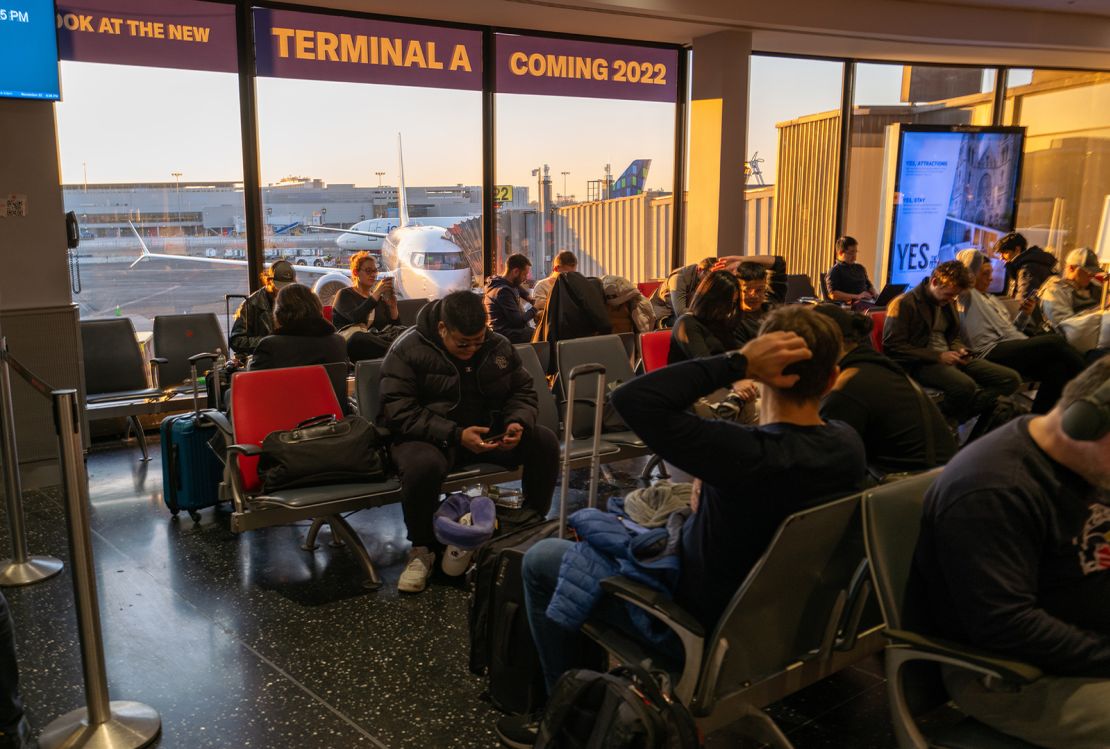 Flying can be nerve-wracking, especially on busy flights. Pictured here: travelers waiting at Newark Liberty International Airport on November 22, 2022.