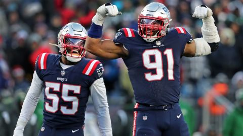 Dietrich Wise Jr. (right) and Josh Uche (left) of the New England Patriots celebrate the sack against the New York Jets.