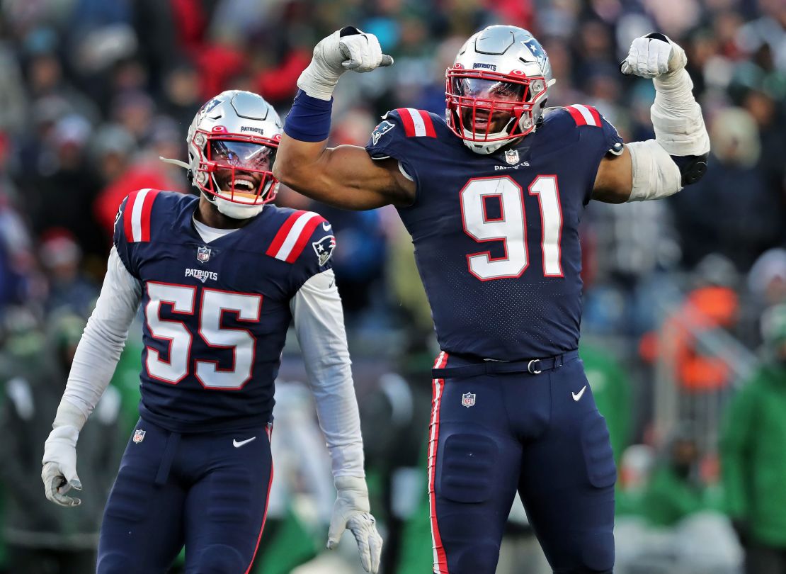 New England Patriots' Deatrich Wise Jr. (right) and Josh Uche (left) celebrate a sack against the New York Jets.