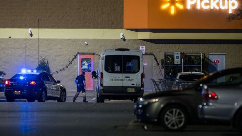 A forensics unit responds to the scene at Walmart early Wednesday.