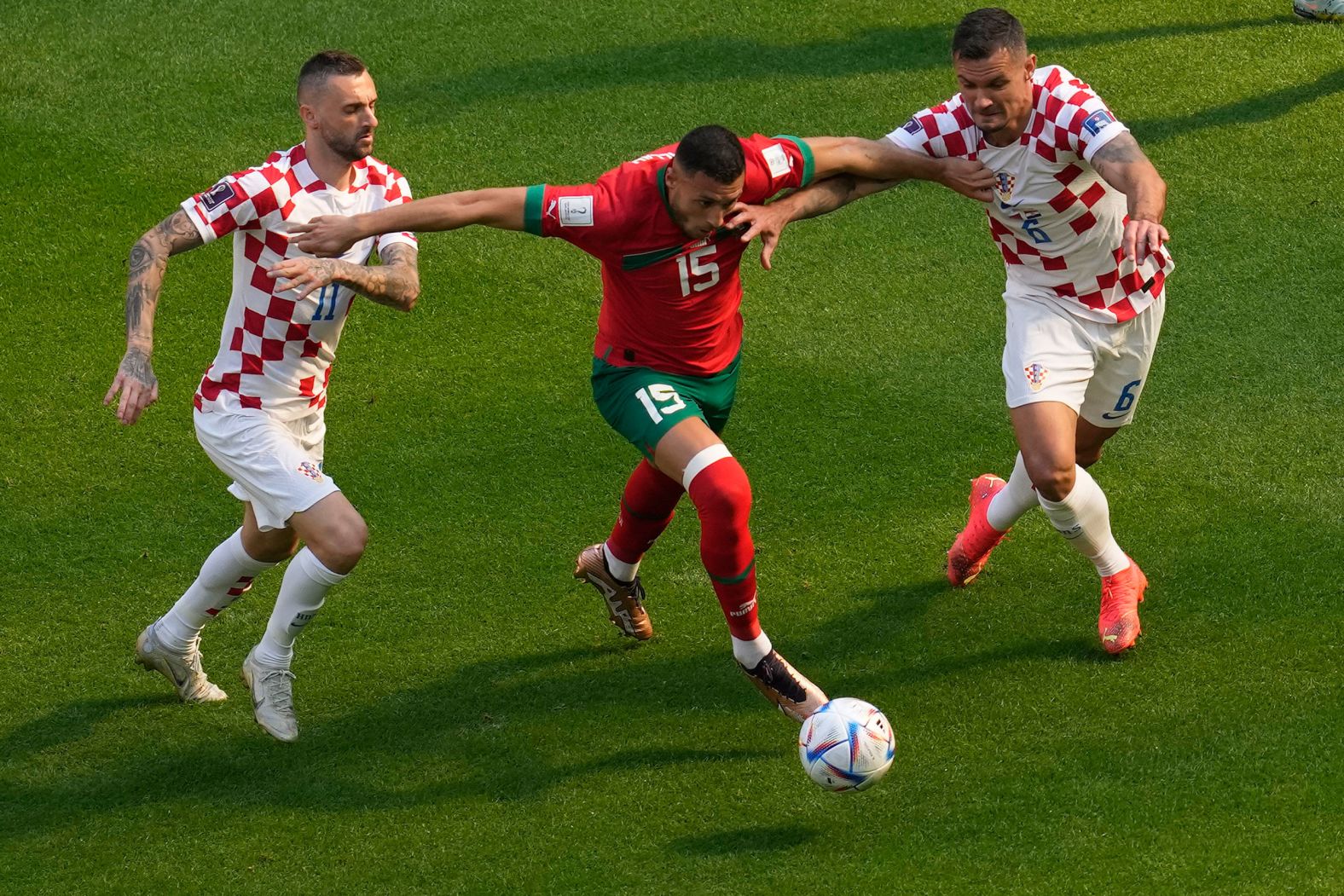 Morocco's Selim Amallah tries to dribble past Croatia's Marcelo Brozovic, left, and Dejan Lovren during their 0-0 draw on November 23. Croatia was the runner-up in the last World Cup.