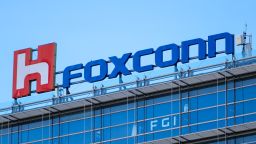 The logo of Foxconn, or Hon Hai Group , which is Taiwans technology giant and the worlds leading producer of semiconductors or chips particularly for Apples devices, is seen on top of the companys headquarters, amid COVID-19 outbreak , in Taipei, Taiwan, 15 July 2021. 