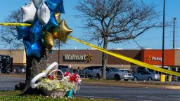 Flowers and balloons have been placed near the scene of a mass shooting at a Walmart, Wednesday, Nov. 23, 2022, in Chesapeake, Va. A Walmart manager opened fire on fellow employees in the break room of the Virginia store, killing several people in the country's second high-profile mass shooting in four days, police and witnesses said Wednesday.  