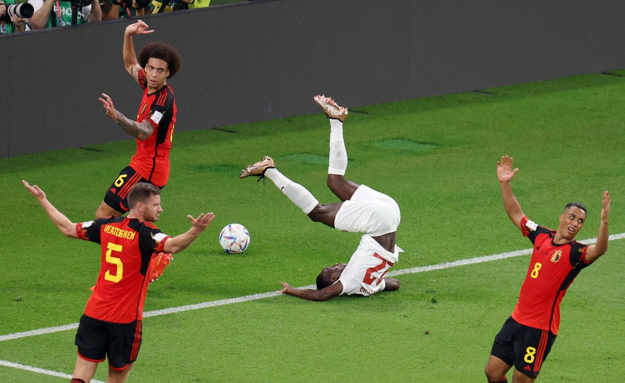 Belgian players insist there is no foul as Canada's Richie Laryea tumbles over in the box on Wednesday.