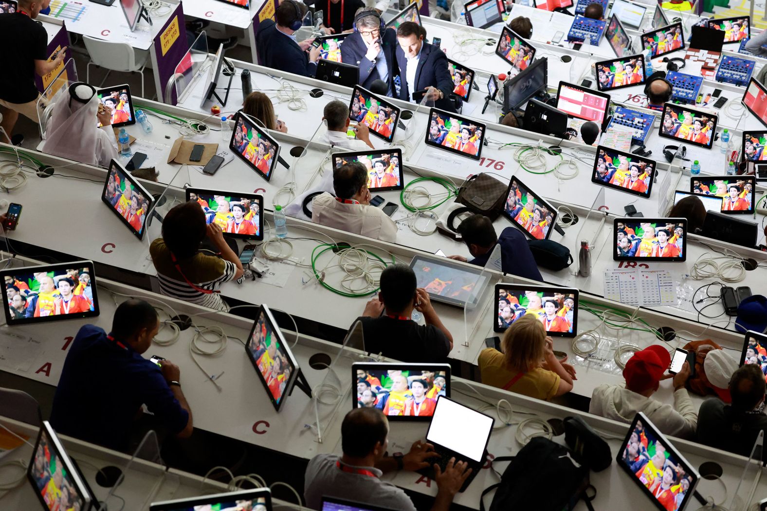 Media members work at Al Thumama Stadium in Doha for the Spain-Costa Rica match.