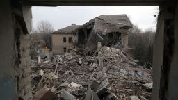 Rescuers clear debris of the destroyed two-storey maternity building in the town of Vilnyansk, southern Zaporizhzhia region, on November 23, 2022, amid the Russian invasion of Ukraine. - "As a result of a rocket attack on the territory of the local hospital, the two-storey building of the maternity ward was destroyed," they said in a statement. There was "a woman with a newborn baby as well as a doctor" inside the building at the time, they added. The baby died while the woman and doctor were rescued from the rubble, rescuers said. (Photo by Katerina Klochko / AFP) (Photo by KATERINA KLOCHKO/AFP via Getty Images)