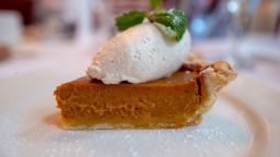 Close-up of plate with pumpkin pie and whipped cream, classic food items during a traditional American Thanksgiving meal, Danville, California, November 28, 2019. 