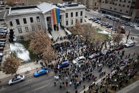 A rainbow flag is draped over the Colorado Springs City Hall on Wednesday, November 23, in honor of the victims of Club Q mass shooting.
