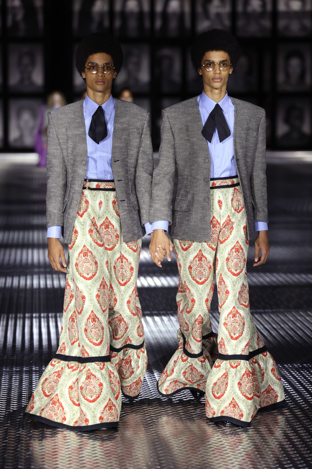 Models walk the runway at Milan Fashion Week in Michele's last major show for Gucci.