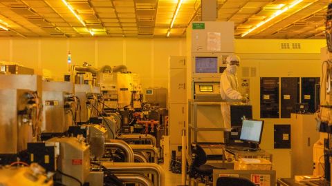 A worker in a clean room for silicon semiconductor wafer manufacturing at the Newport Wafer Fab, owned by Nexperia, in Newport, Wales on Aug. 18.