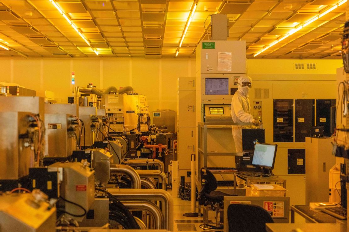 A worker in a clean room for silicon semiconductor wafer manufacturing at the Newport Wafer Fab, owned by Nexperia, in Newport, Wales on Aug. 18.