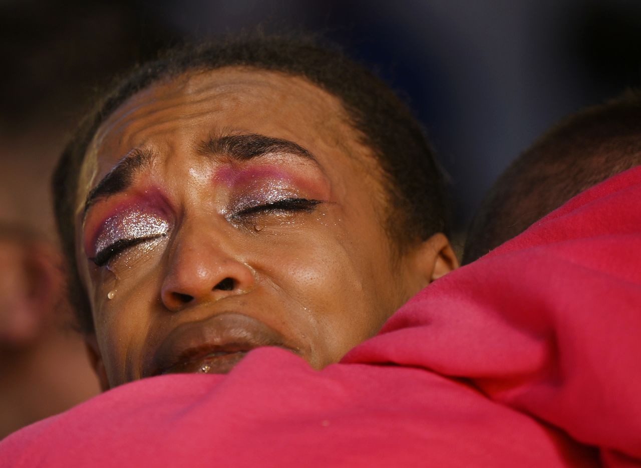 Leia-jhene Seals hugs R.J. Lewis during a vigil Sunday, November 20, at the All Souls Unitarian Church in Colorado Springs, Colorado. Seals was performing the night before when a shooter opened fire in the Club Q nightclub.