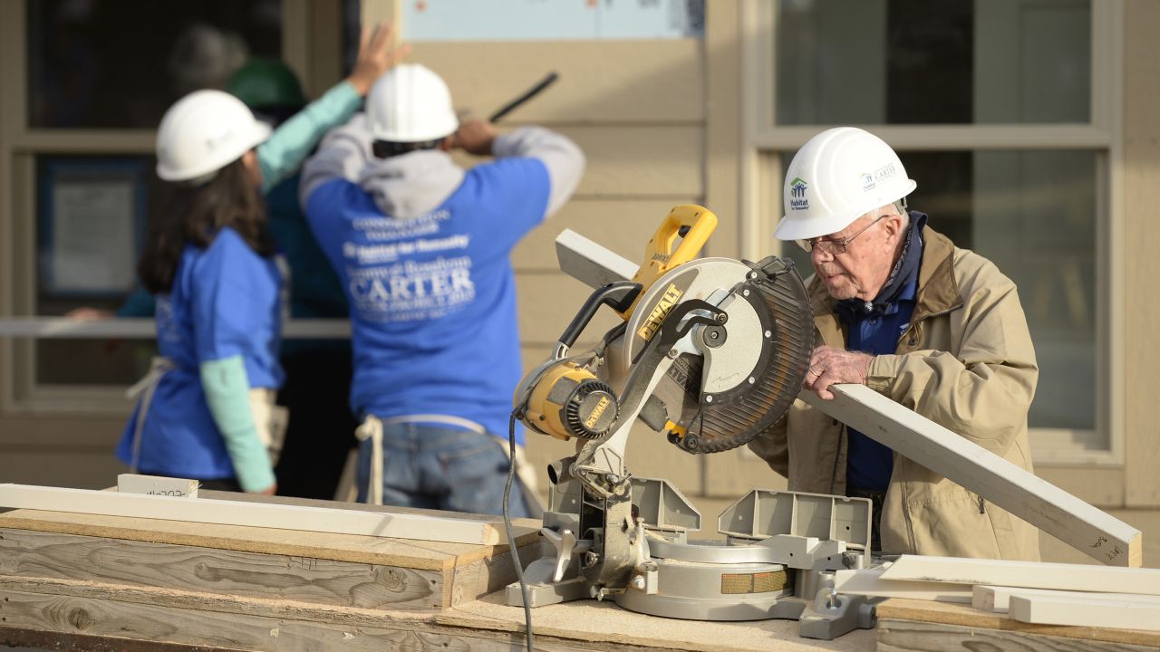 Former president Jimmy Carter works on building a home during a Habitat for Humanity event in Denver, Colorado, in 2013.