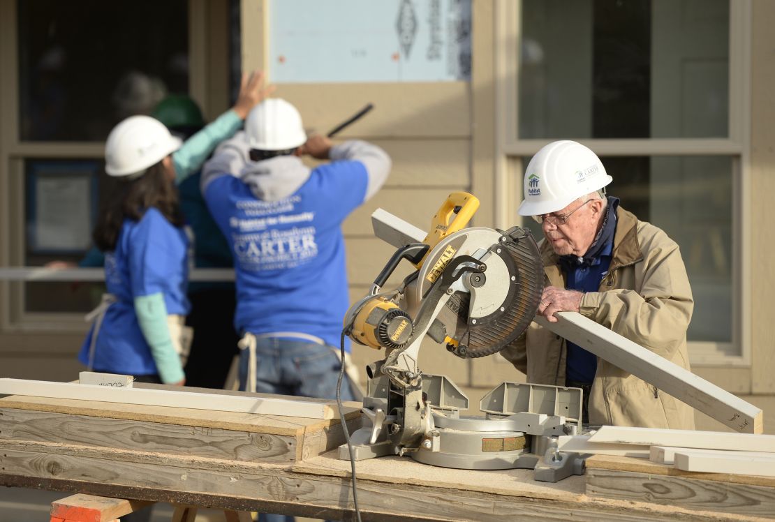 Former president Jimmy Carter works on building a home during a Habitat for Humanity event in  Denver, Colorado, in 2013. 