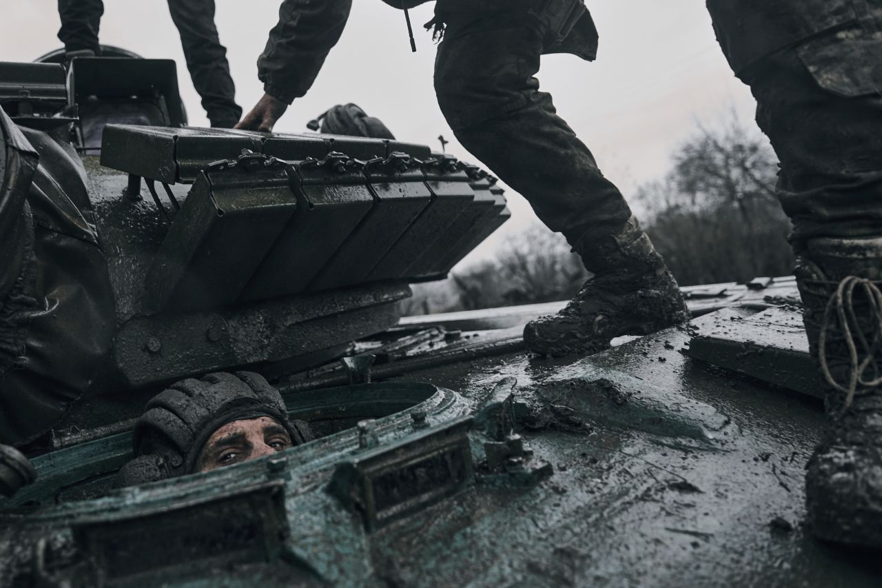 A Ukrainian soldier peers out of a captured Russian tank in Ukraine's Donetsk region on Tuesday, November 22.