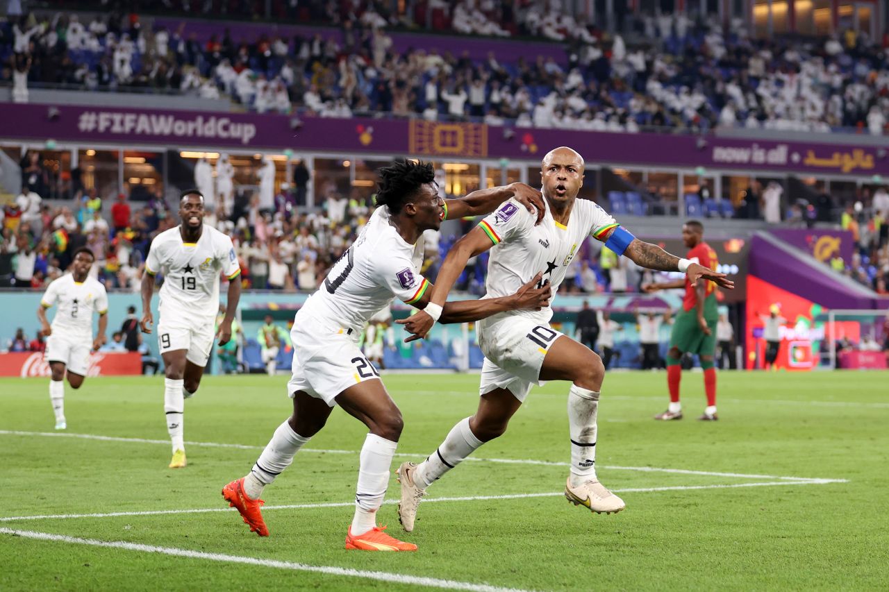 Ghana's Andre Ayew, right, celebrates with Mohammed Kudus after tying the match at 1-1 shortly after Ronaldo's penalty.