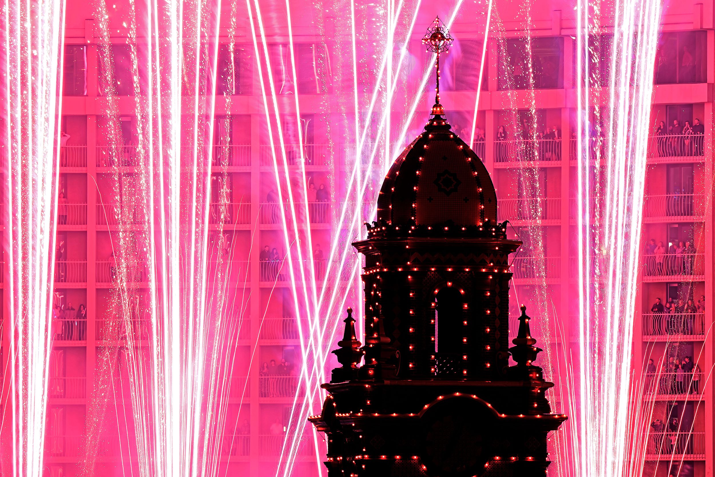 Christmas lights at the Country Club Plaza shopping district in Kansas City, Missouri, are switched on amidst fireworks on Thursday.