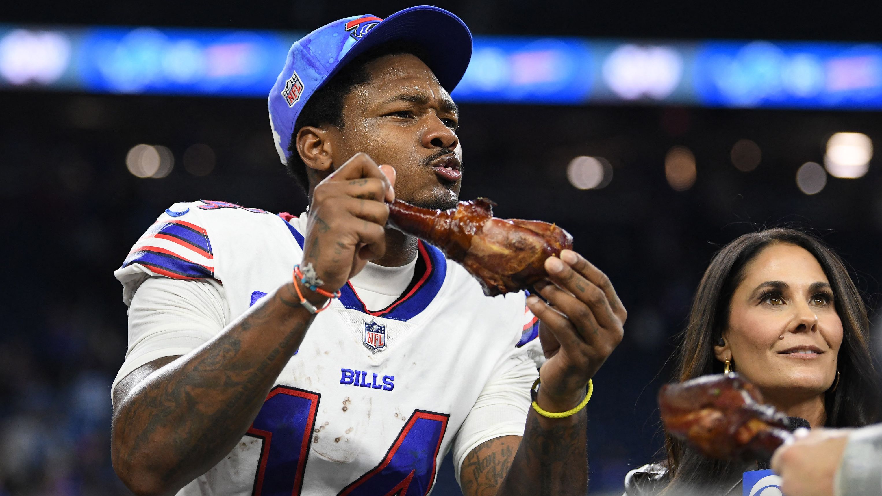 Buffalo wide receiver Stefon Diggs digs into a turkey leg after the Bills defeated Detroit on Thanksgiving Day.