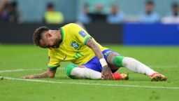 24 November 2022, Qatar, Lusail: Soccer: World Cup, Brazil - Serbia, Preliminary round, Group G, Matchday 1, Lusail Iconic Stadium, Brazil's Neymar sits on the ground after foul. 