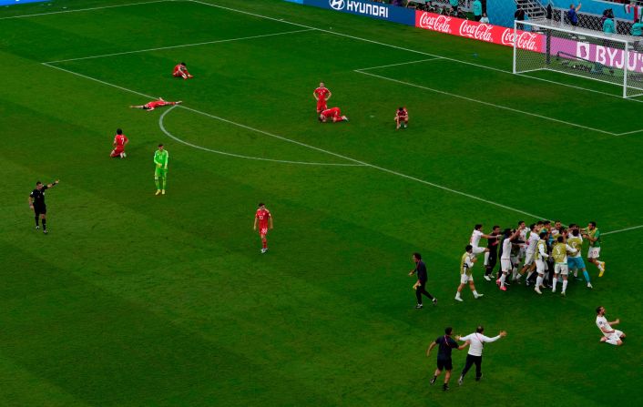 Welsh players are dejected as Iran celebrates on Friday.