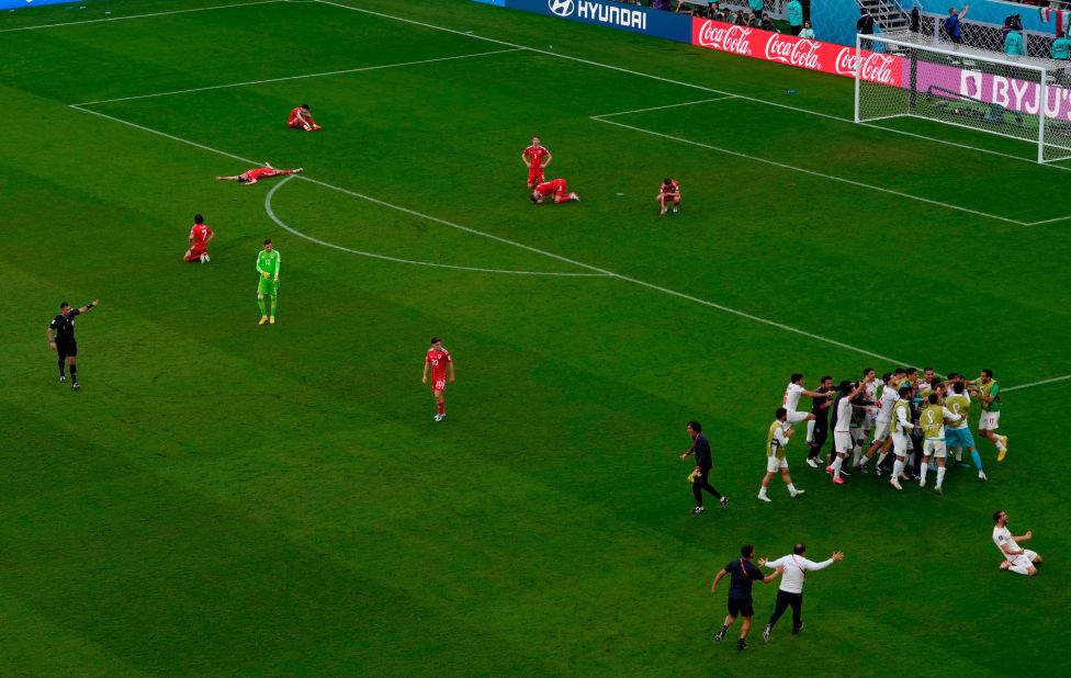 Welsh players are dejected as Iran celebrates on Friday.